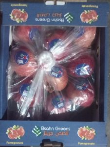 An Elsahn Greens pomegranate carton packed and ready to close