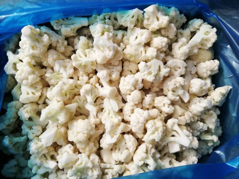 IQF cauliflower florets, white and closely graded, in a blue-lined crate