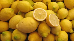 Egyptian lemons, one cut to show the juice content
