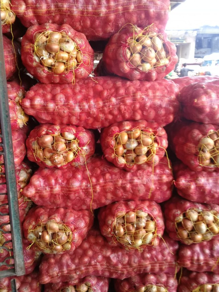 Stacked mesh bags of onions ready for dispatch