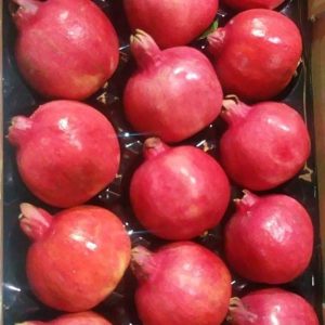 Pomegranates packed into a tray