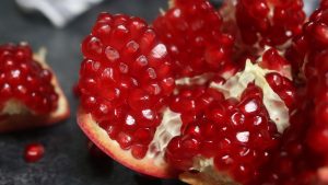 A pomegranate broken open to show deep red arils